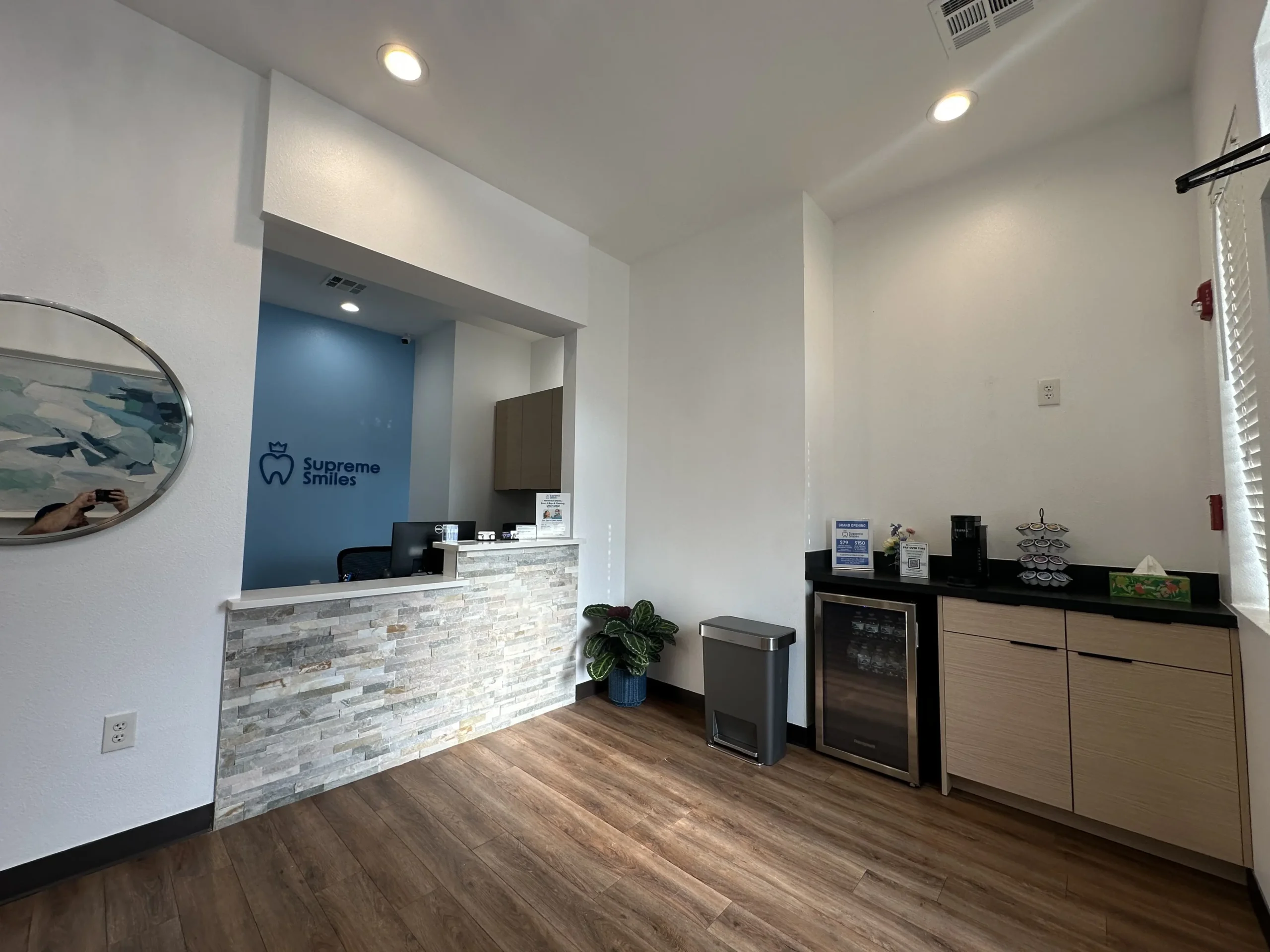 Dentist Highland Village front desk and refreshment area with modern interior