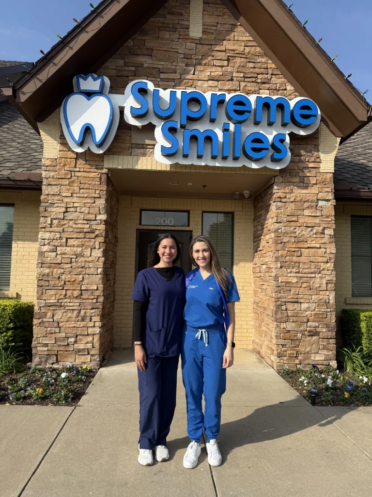 Dr. Hadeel saleh with his team member outside Supreme Smiles Dentistry